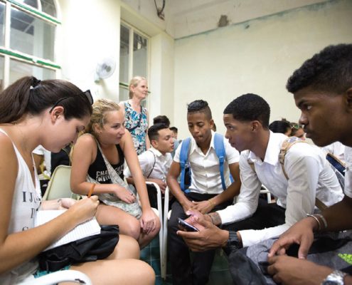 Student's in the College's study-abroad program interact with Cuban students, discussing the cultural differences between Cuba and the United States.